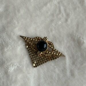 Elegant Gold and Black Brooch